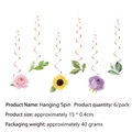 Close-up of six hanging swirl decorations featuring vibrant floral patterns for parties - Swirl Decoration