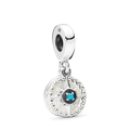 Detailed view of sterling silver starburst charm with turquoise bead and shell inlay - Compass Starburst Style