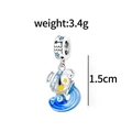 Macro detail of Aquarius zodiac charm with blue enamel and star elements, 1.5cm height - Aquarius
