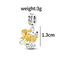 Macro detail of S925 silver Leo zodiac charm with gold plating and star motif - Leo