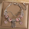 Detailed shot of a silver charm bracelet with pink crystal beads and dreamcatcher pendant - 16cm / Light Pink Style (LPH23811/1710-2)