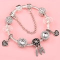 Silver snake chain bracelet with heart and dreamcatcher charms on pink background - Black Rhinestone Dreamcatcher Style (LPH23811/1710-6)