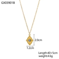 Detail of gold oval pendant with round blue gemstone and starburst texture engraving - Oval Coin Blue Rhinestone Necklace (GX03901B)