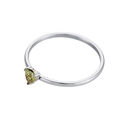Close-up of yellow heart-shaped gemstone with three-prong setting on a thin gold ring - August (Silver)