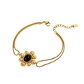 Detail eines goldenen Vintage-Armbands mit schwarzem Edelstein und doppelter Gliederkette - Vintage Stil mit schwarzem Edelstein und Sonnenblume (HS1130B2)