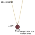 Detail of a minimalist gold chain necklace with a clear zircon and burgundy bead pendant - Wine Red Pearl Zirconia Pendant Necklace (ZX44305B2B0)