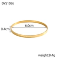 Detail view of gold bangle with Hakuna Matata engraving and 6.0cm inner diameter size - Gold Slim Engraved Style (DYS1036)