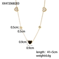 Detail of gold chain necklace featuring black heart and white mother of pearl pendants - Beaded Triple Heart Black White Gold Style (XX47206B9E0)