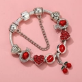 Close-up of silver snake chain bracelet featuring red heart charms and cherry pendant - Red Cherry Lips Style (SL023316-D) / 16cm
