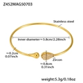 Detail of gold stainless steel wave bangle with cubic zirconia water drop accents - Waterdrop Open Style (Z452-Gold Zirconia Bangle)