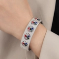 Bracciale rigido largo in acciaio argento con fiori traforati e zirconi colorati - Bracciale Floreale Color Acciaio con Strass Colorati (Z346)