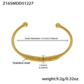 Detail of golden stainless steel spring bracelet showing 6.5cm diameter and 9.2g weight - Beaded Spring Spiral Style / Gold Bangle (Z165)
