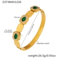 Detailed close-up of 18k gold plated stainless steel bangle with green emerald zircons - Gold Geometric Link Green Zircon Bangle (Z373)