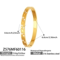 Detailed view of 18k gold-plated bangle with engraved flowers and cubic zirconia stones - Gold Style (Z576)