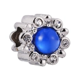Macro view of flower charm with blue round gemstone and crystal pavé details - Petal Border Blue Bead (#4)