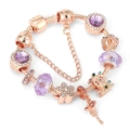 Detail of rose gold charm bracelet featuring pink heart, crystal beads and ferris wheel - 16cm / Rose Gold Style 4
