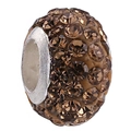 Macro detail of brown crystal clay bead with 4 rows of amber rhinestones for DIY bracelets - Orange