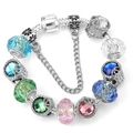 Macro view of colorful crystal beads and heart pendants on a silver snake chain bracelet - 21cm / Silver