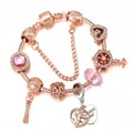 Detail of rose gold charm bracelet with pink gemstones, heart pendants and safety chain - Pink Gem Anchor Tassel Style (Double Color #5)