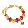 Detail of gold beaded bracelet with red pave crystals and I Love You heart charm - 16cm / Red