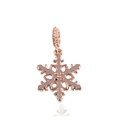 Macro detail of rose gold snowflake charm with pavé setting and geometric cutouts - Rose Gold Hollow Snowflake (9)