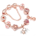 Dettaglio del bracciale in oro rosa con perle di cristallo rosa e ciondoli HAPPY - 16cm / Stile Cuore Lettera Happy