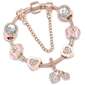 Rose gold charm bracelet with pink crystals, heart charms, and secure snake chain - 16cm