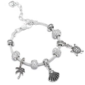 Detail of silver-plated bracelet featuring turtle, shell, and palm tree charms - 16cm / Ocean Marine Set (A-1)
