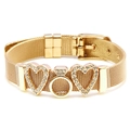 Gold mesh bracelet with MOM design sliders and heart details on white background - Heart and Ring Design / Gold