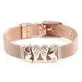 Detail of rose gold mesh bracelet featuring 3D heart charms and delicate wing pendant - Angel Wings and Heart Design / Rose Gold