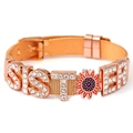 Rose gold mesh bracelet featuring rhinestone SISTER lettering and enamel sunflower detail - SISTER / Rose Gold