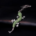 Sparkling green crystal lizard keychain with silver alloy finish on a black background - Green
