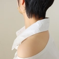 Minimalist golden star hoop earrings for women shown on a model's ear - Medium / Gold