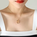 Gold pendant necklace with colorful cubic zirconia and V-shaped letter detail - Letter V
