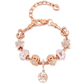 Detailed close-up of rose gold charm bracelet with flower, heart, and tree of life pendants - Pink Crystal Flower Life Tree Style (#6)