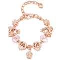 Close-up of rose gold charm bracelet with pink crystals and heart crown pendants - Snowflake Crown Crystal Style (#7)
