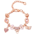 Macro shot of rose gold charm bracelet with pink crystals and heart pendant detail - Pink Crystal Bow Style (#3) / 16cm