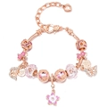 Detail of rose gold charm bracelet featuring pink cherry blossoms and butterfly pendants - Pink Sakura Butterfly Style (#9)