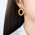 Minimalist gold-plated twisted hoop earrings with a polished finish for women - Gold
