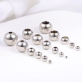 Close-up of assorted sizes of polished stainless steel beads for DIY jewelry making - Width 2mm Hole 1mm / Steel