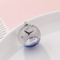 Resin sphere pendant featuring a black whale tail and sparkling blue ocean glitter details - Whale Tail Starry Style (kp6388)