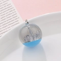Blue sky resin sphere pendant with miniature silver mountains and metal loop - Miniature Mountain Crystal Style (kp6388)