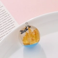 Resin ball pendant with golden crystal and black bird inside blue miniature landscape - Golden Crystal Bird Style (kp6388)