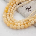 Polished amber yellow jade round beads for DIY jewelry with linen drawstring storage bag - 4mm (10 Counts) / Cream Yellow Jade - Style 69