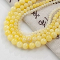 Polished yellow jade round beads in various sizes for DIY jewelry and necklaces - 4mm (10 Counts) / Cream Yellow Jade - Style 70