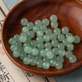 Translucent light green abacus beads in a wooden tray for DIY oriental jewelry - 4# Light Green