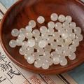 Translucent milky white abacus beads for jewelry making on a dark wooden tray - 8# Milk White