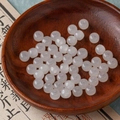 Translucent milky white round beads on a wooden tray for DIY jewelry making - 9# Translucent White