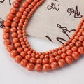 Vibrant orange turquoise beads with black spiderweb patterns for DIY jewelry making - Turquoise-146