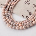 Pink synthetic turquoise round beads with black veins for DIY jewelry making - Turquoise-148